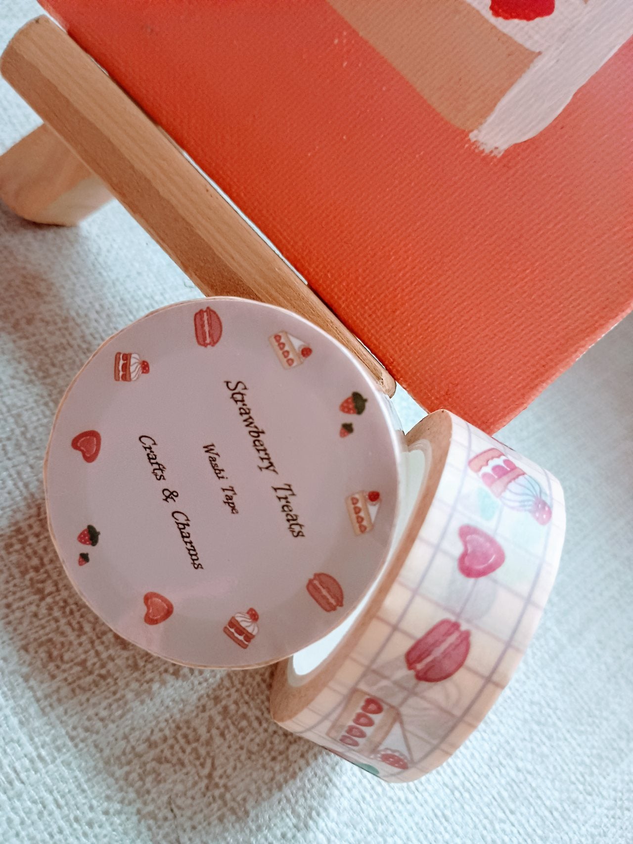 Washi tape labeled 'Strwberry Treats' with cute illustrations of straberry desserts on top a table