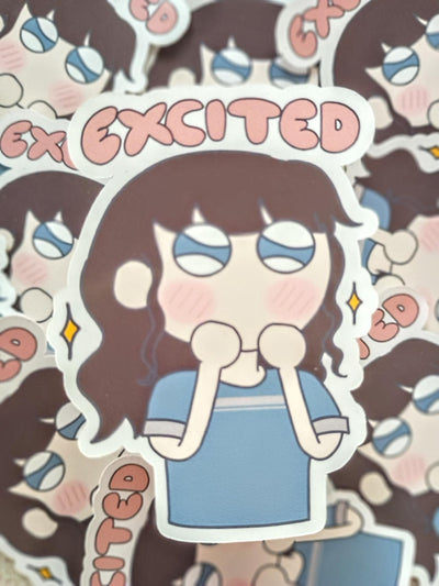 Sticker with girl in t-shirt in anime style art with an excited expression. the pink text on the sticker says exicited.