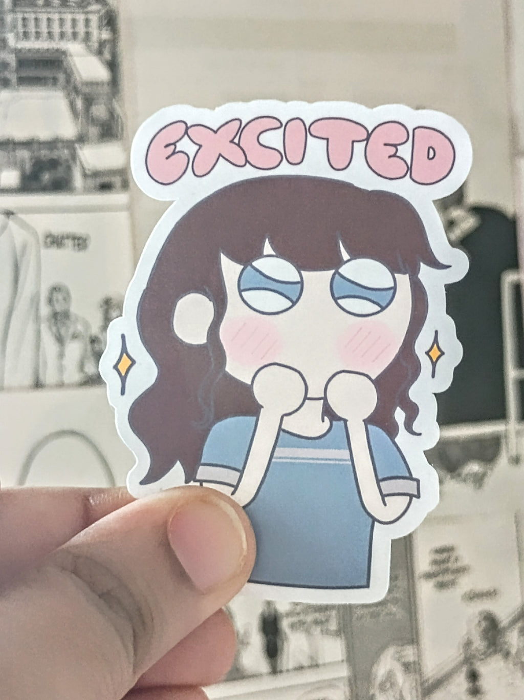 Sticker with girl in t-shirt in anime style art with an excited expression. the pink text on the sticker says exicited.