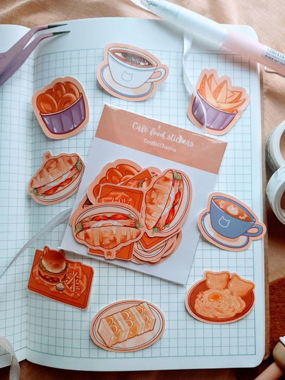 Pack of cafe food stickers surrounded by burger and fries, americano, latte, croissant sandwitch, egg sandwitch, onion ings, potato wedges and carbonara with garlic bread stickers  